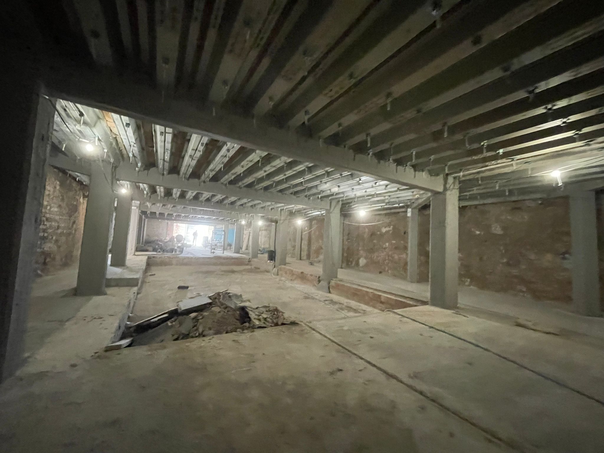The DONDE club basement, second view: original column work and overhead steel reinforcement